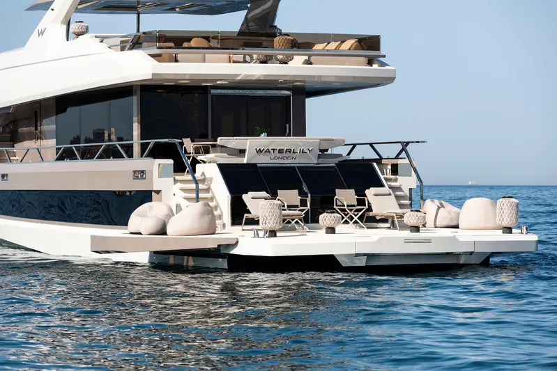  Yacht Photos Pics Luxury 2025 Mazu Yachts 92 DS on serene ocean, featuring elegant outdoor seating.