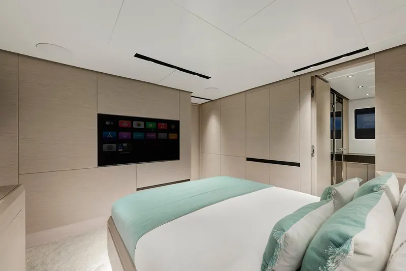  Yacht Photos Pics Luxurious bedroom interior of 2025 Mazu Yachts 92 DS with modern design and TV.