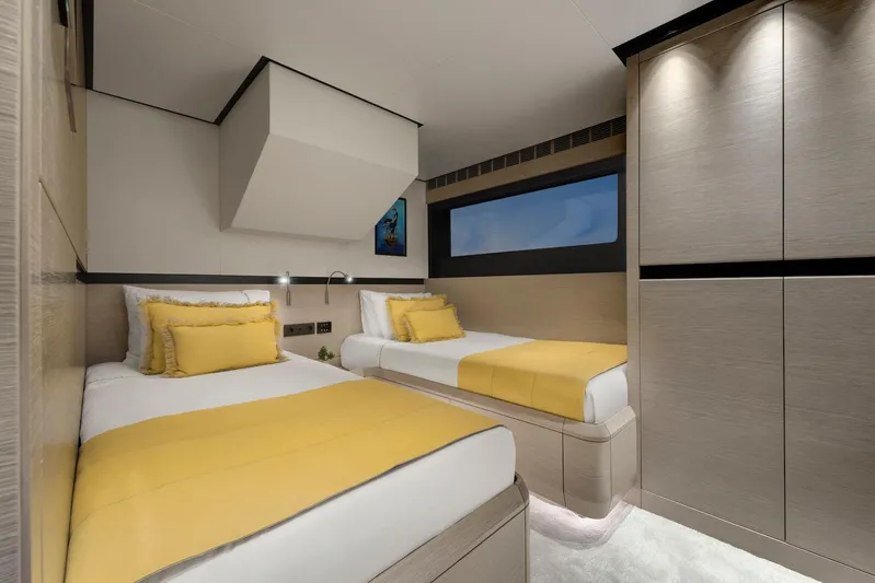  Yacht Photos Pics Luxurious twin bedroom on 2025 Mazu Yachts 92 DS with modern design and yellow accents.