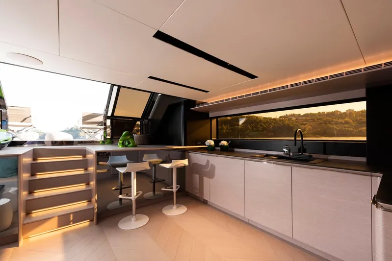  Yacht Photos Pics Luxurious interior of 2025 Mazu Yachts 92 DS with modern kitchen and seating area.