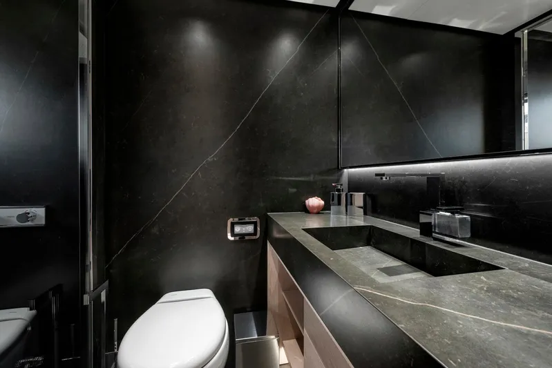  Yacht Photos Pics Luxurious bathroom in 2025 Mazu Yachts 92 DS, featuring sleek black design and modern fixtures.