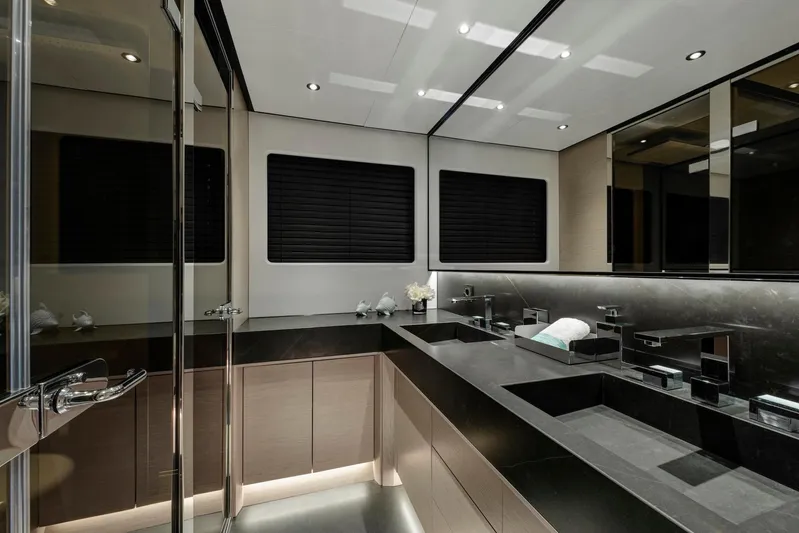  Yacht Photos Pics Luxurious bathroom interior of 2025 Mazu Yachts 92 DS with sleek black countertops.
