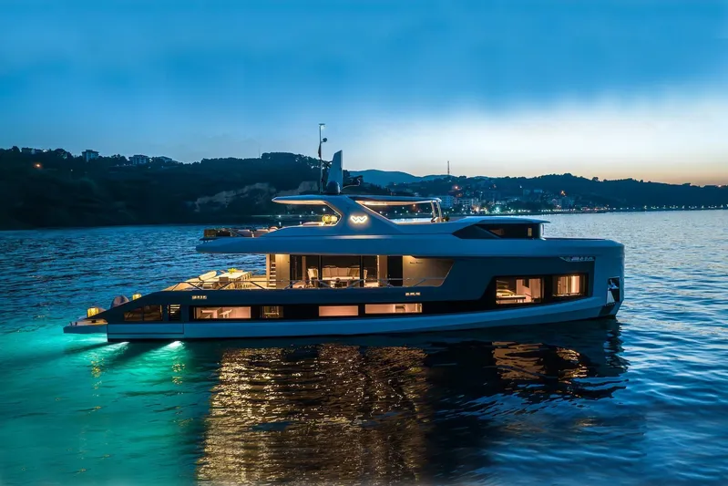 Yacht Photos Pics Luxury 2025 Mazu Yachts 92 DS cruising at sunset on serene waters.