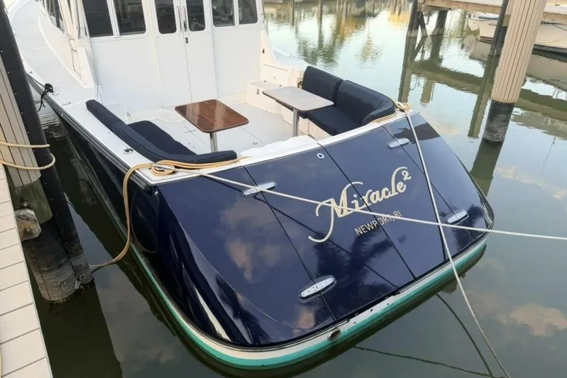 Miracle 2 Yacht Photos Pics 2006 True North 38 yacht docked, featuring a sleek design and spacious deck area.