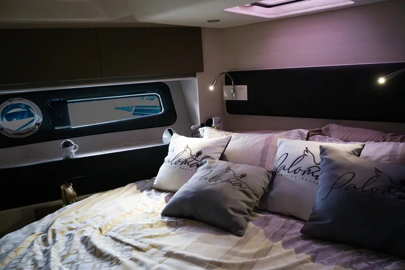 La Paloma Yacht Photos Pics Luxurious bedroom interior of 2019 Azimut Fly 50 yacht with elegant bedding and ambient lighting.