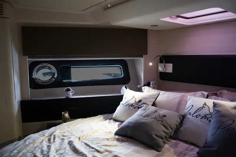La Paloma Yacht Photos Pics Luxurious bedroom interior of 2019 Azimut Fly 50 yacht with elegant bedding and modern lighting.