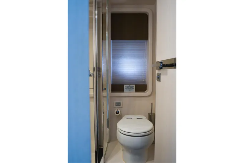La Paloma Yacht Photos Pics Bathroom interior of 2019 Azimut Fly 50 yacht, featuring modern toilet and window.