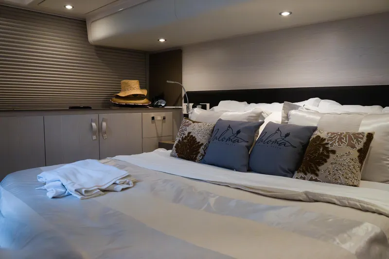La Paloma Yacht Photos Pics Luxurious bedroom interior of 2019 Azimut Fly 50 yacht with elegant decor and soft lighting.