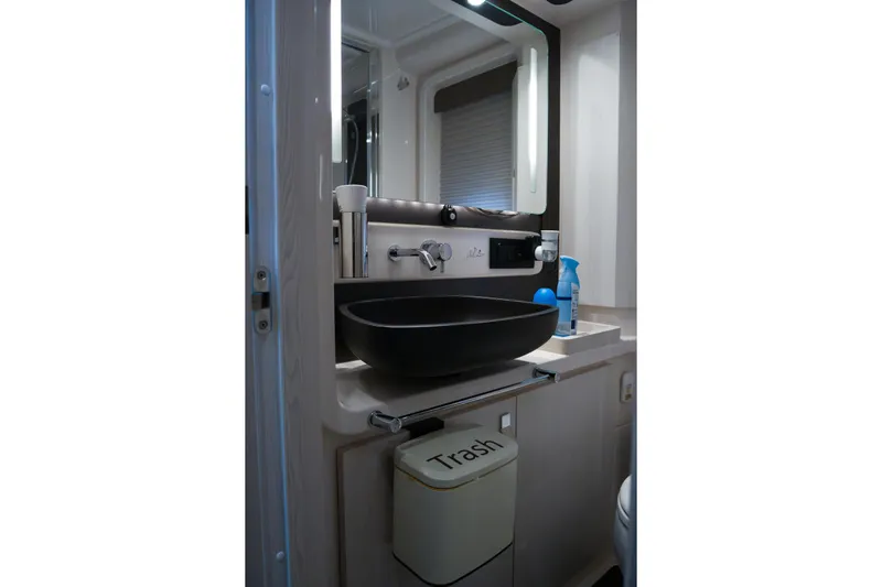 La Paloma Yacht Photos Pics Modern bathroom interior of 2019 Azimut Fly 50 yacht with sleek black sink.