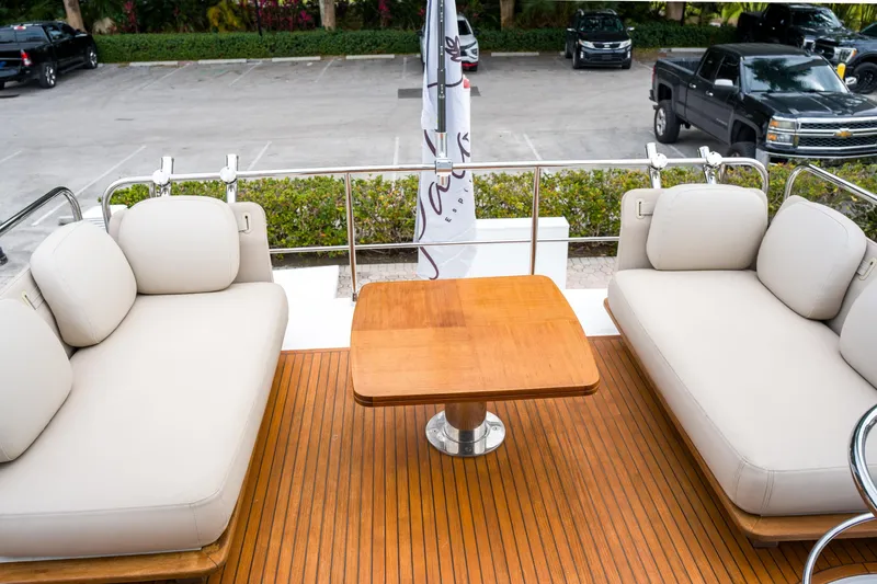 La Paloma Yacht Photos Pics Luxurious 2019 Azimut Fly 50 yacht deck with elegant seating and wooden table.