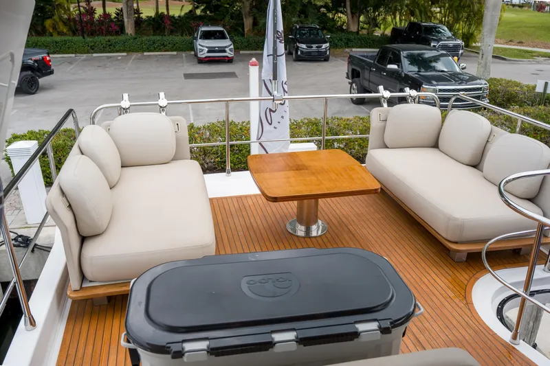 La Paloma Yacht Photos Pics Luxurious 2019 Azimut Fly 50 yacht deck with plush seating and wooden table.