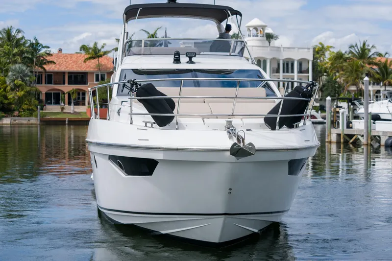 La Paloma Yacht Photos Pics Front view of a 2019 Azimut Fly 50 yacht docked in a marina.