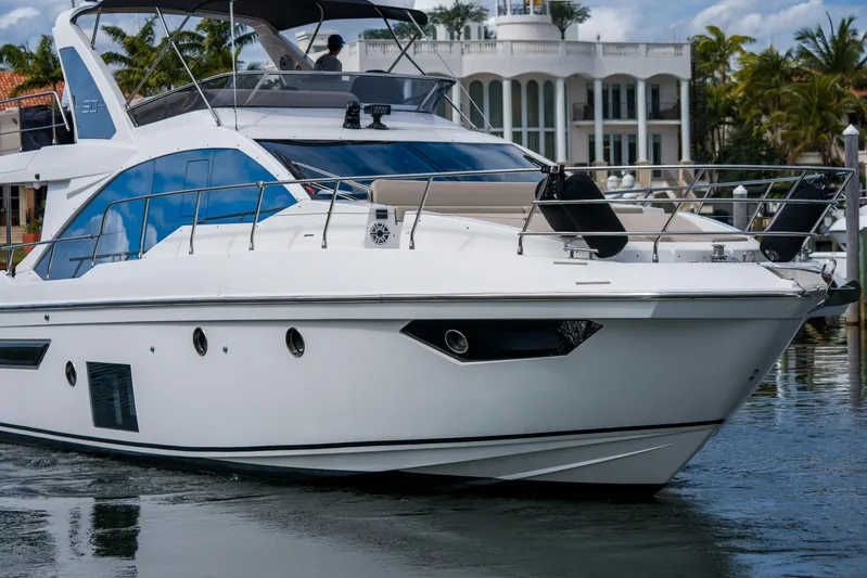 La Paloma Yacht Photos Pics Luxury 2019 Azimut Fly 50 yacht cruising near waterfront mansion.