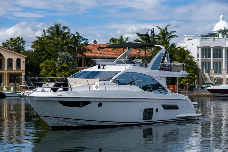La Paloma Yacht Photos Pics 2019 Azimut Fly 50 yacht docked near luxury waterfront homes.
