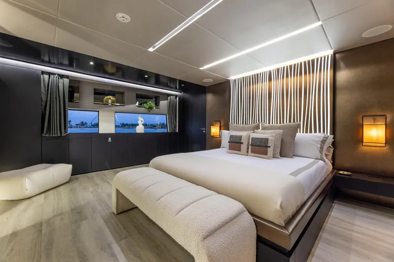 Maverick Yacht Photos Pics Luxurious bedroom interior on 2013 Admiral Impero 40 yacht, featuring modern design and ambient lighting.