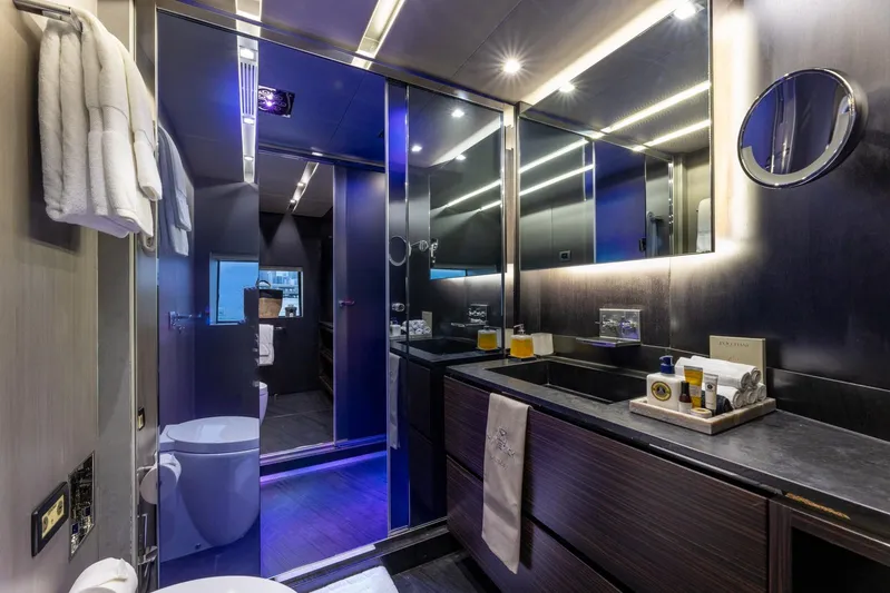 Maverick Yacht Photos Pics Luxurious bathroom on 2013 Admiral Impero 40 yacht with modern fixtures and ambient lighting.