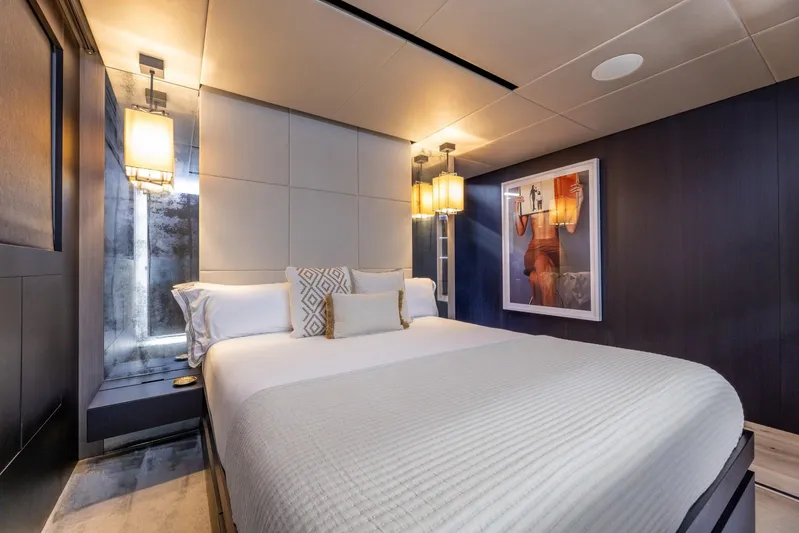 Maverick Yacht Photos Pics Luxurious bedroom interior on 2013 Admiral Impero 40 yacht, featuring modern design and elegant lighting.