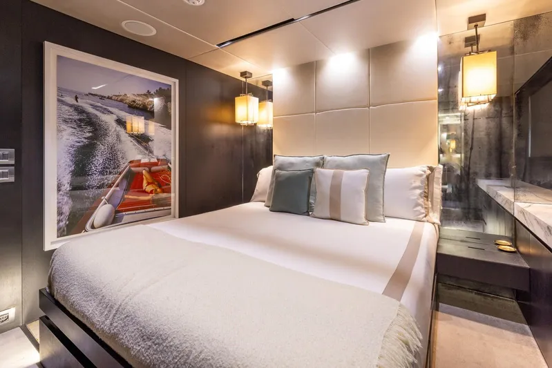 Maverick Yacht Photos Pics Luxurious bedroom interior on 2013 Admiral Impero 40 yacht, featuring elegant decor and ambient lighting.