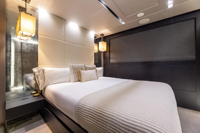 Maverick Yacht Photos Pics Luxurious bedroom interior on 2013 Admiral Impero 40 yacht, featuring elegant lighting and modern design.