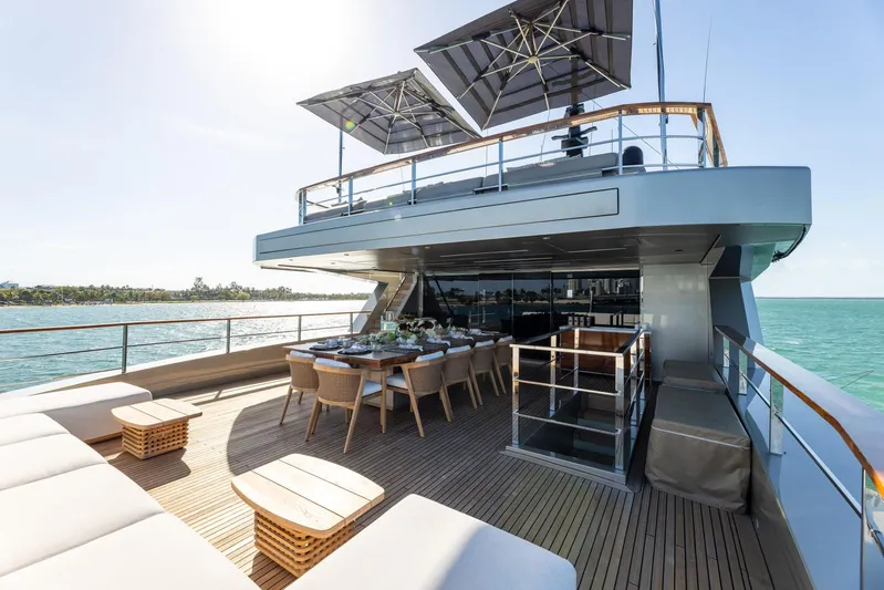 Maverick Yacht Photos Pics Luxury Admiral Impero 40 yacht deck with dining area, 2013 model, ocean view.