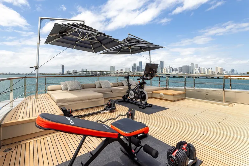 Maverick Yacht Photos Pics Luxury yacht Admiral Impero 40, 2013, with gym equipment and city skyline view.
