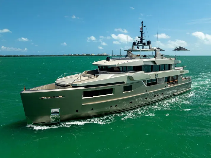 Maverick Yacht Photos Pics Luxurious 2013 Admiral Impero 40 yacht cruising on turquoise waters under clear skies.