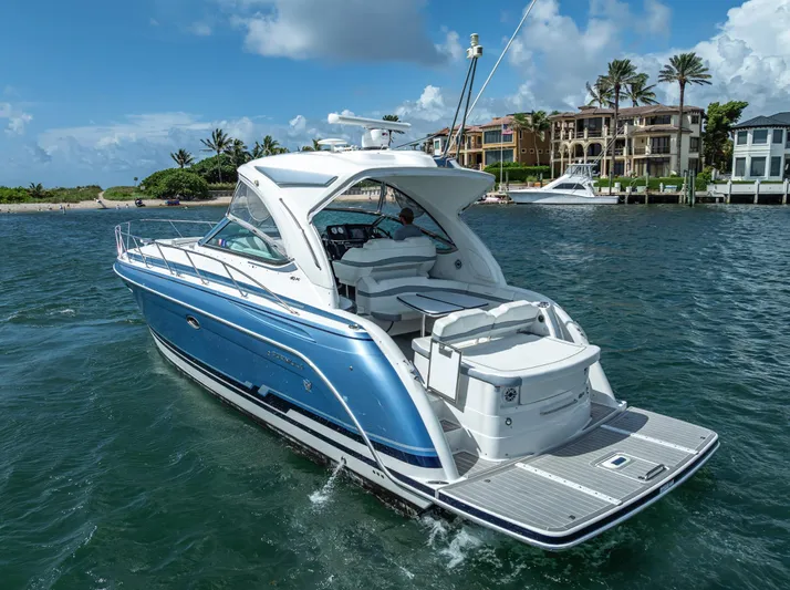  Yacht Photos Pics 2022 Formula 40 PC yacht cruising near luxury waterfront homes.