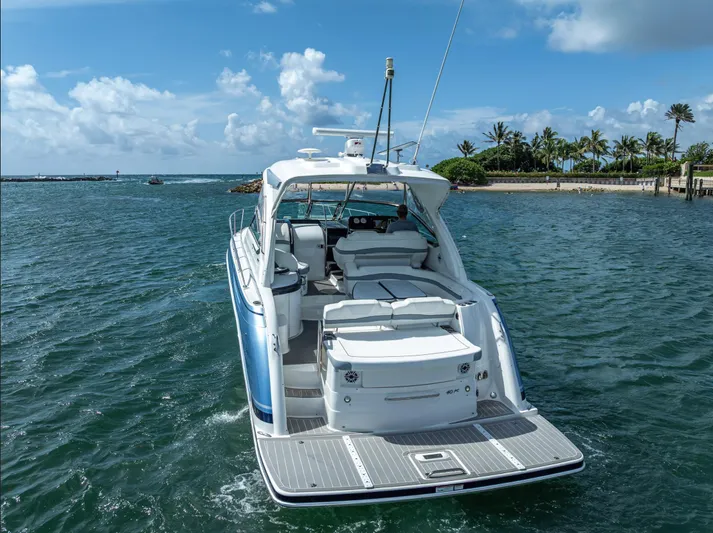  Yacht Photos Pics 2022 Formula 40 PC yacht cruising on a sunny day near a tropical shoreline.