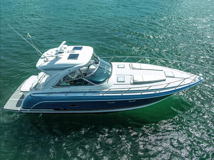  Yacht Photos Pics 2022 Formula 40 PC yacht cruising on clear blue water.