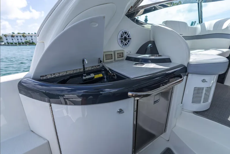  Yacht Photos Pics 2022 Formula 40 PC yacht interior with kitchenette and seating area.