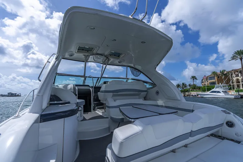  Yacht Photos Pics 2022 Formula 40 PC yacht interior with seating, under a blue sky and waterfront view.
