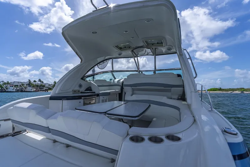  Yacht Photos Pics Luxury 2022 Formula 40 PC yacht interior with seating, table, and ocean view.