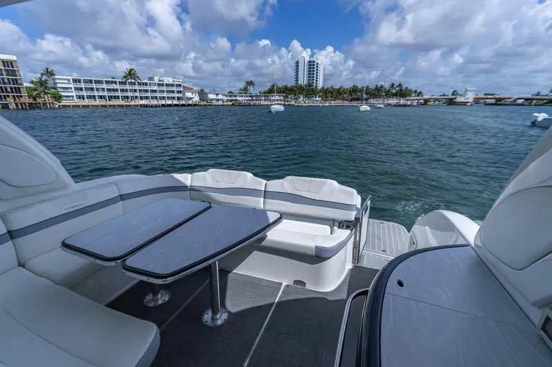  Yacht Photos Pics Luxury seating area on 2022 Formula 40 PC yacht overlooking scenic waterfront.