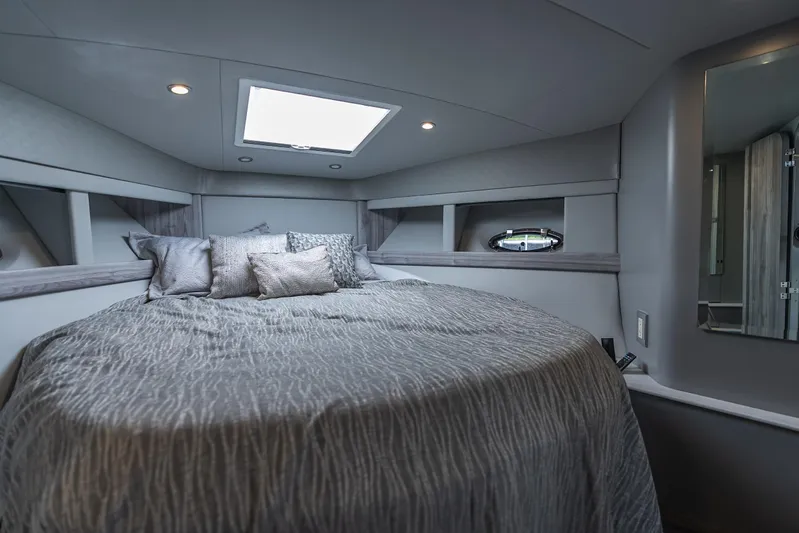  Yacht Photos Pics Luxurious 2022 Formula 40 PC yacht bedroom with skylight and elegant bedding.