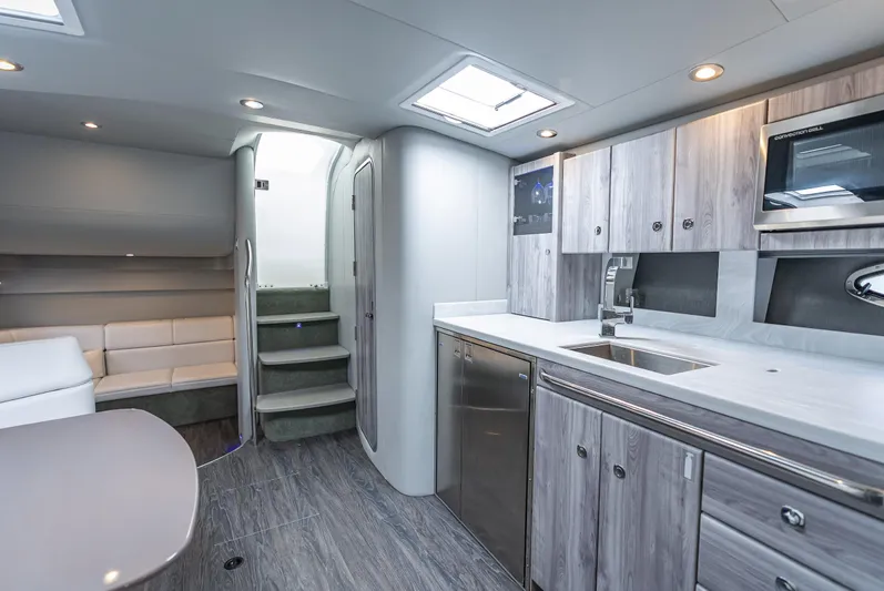  Yacht Photos Pics Luxurious interior of 2022 Formula 40 PC yacht with modern kitchen and seating area.