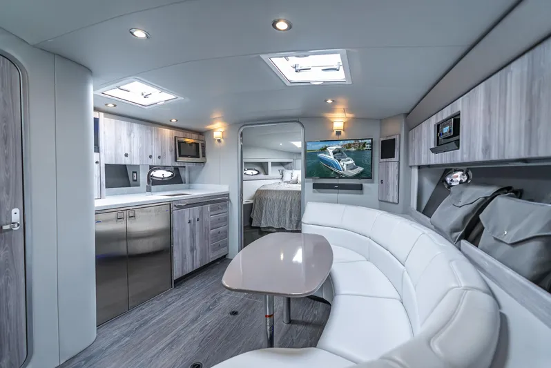 Yacht Photos Pics Luxurious interior of 2022 Formula 40 PC yacht with modern kitchen and seating area.
