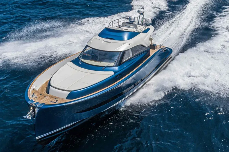  Yacht Photos Pics 2026 Solaris Power 48 Flybridge yacht cruising on open blue waters.