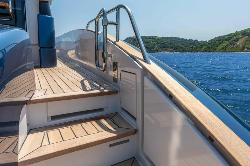  Yacht Photos Pics 2026 Solaris Power 48 Flybridge yacht with elegant wooden deck and ocean view.