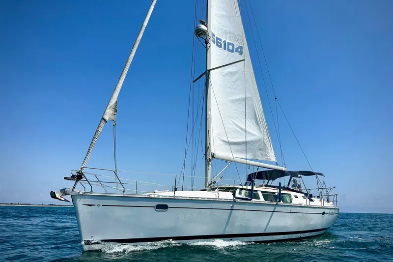  Yacht Photos Pics Sailing yacht Jeanneau Sun Odyssey 43 DS, 2001 model, cruising on open water.