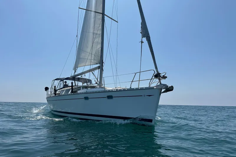  Yacht Photos Pics Sailing yacht Jeanneau Sun Odyssey 43 DS, 2001 model, cruising on open sea.