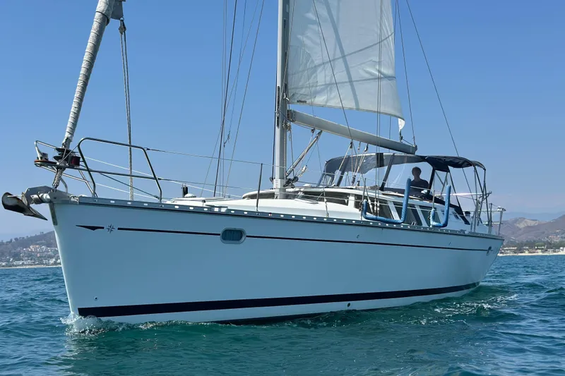  Yacht Photos Pics 2001 Jeanneau Sun Odyssey 43 DS sailing on calm blue waters.