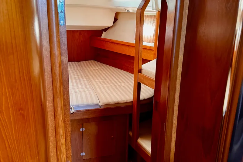 Yacht Photos Pics Interior cabin of 2001 Jeanneau Sun Odyssey 43 DS sailboat with wooden finish.