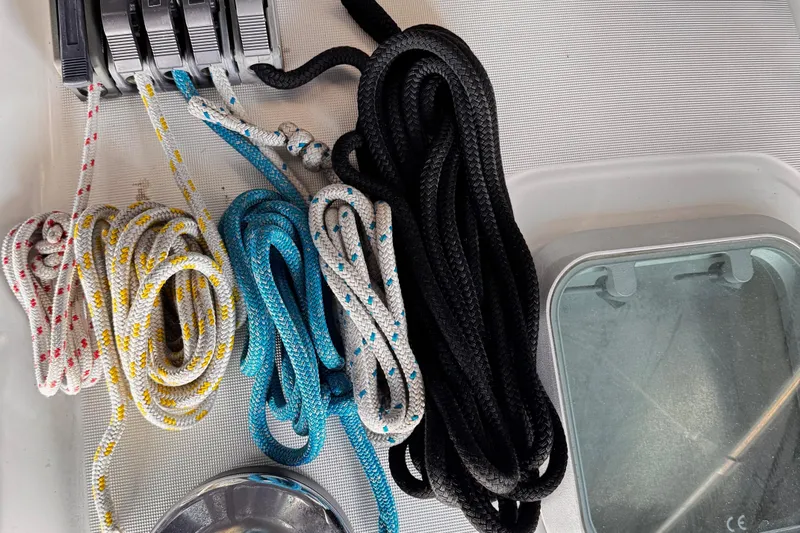  Yacht Photos Pics Colorful ropes and cleats on Jeanneau Sun Odyssey 43 DS, 2001 model sailboat deck.