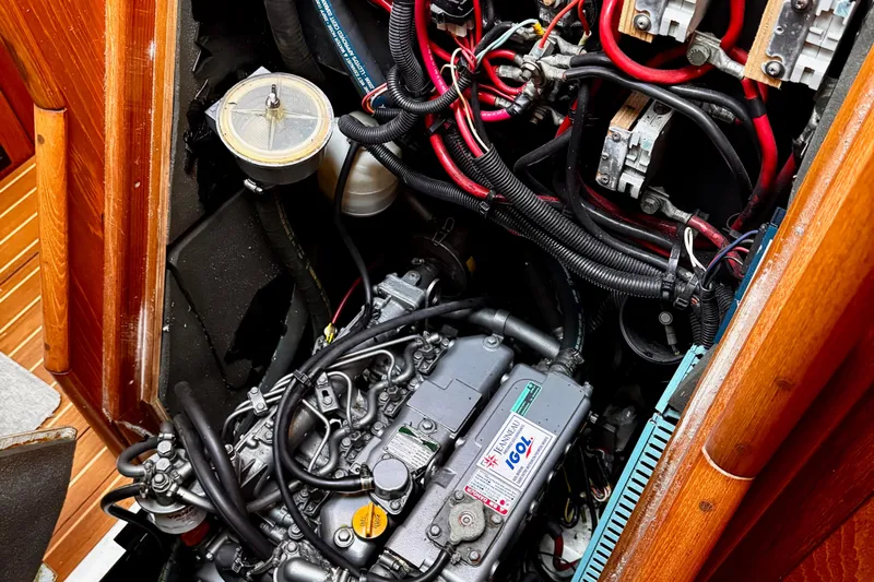  Yacht Photos Pics Engine compartment of a 2001 Jeanneau Sun Odyssey 43 DS sailboat, showing detailed wiring and components.
