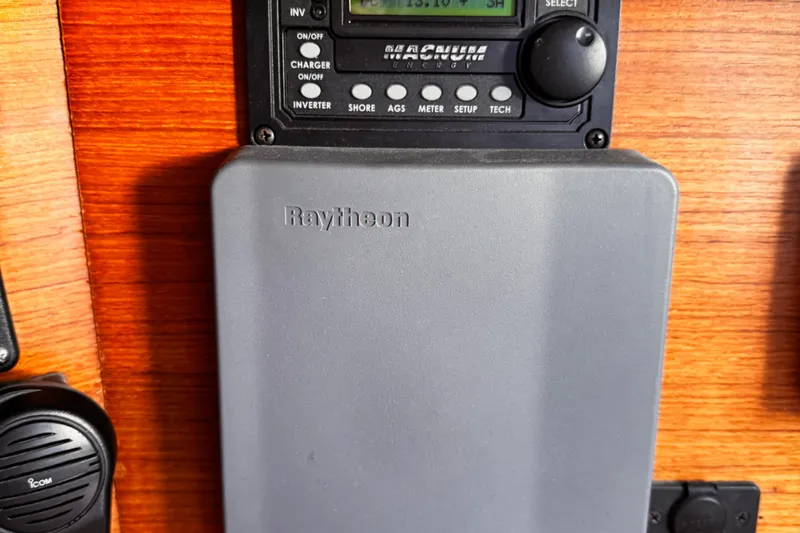  Yacht Photos Pics Raytheon marine equipment on Jeanneau Sun Odyssey 43 DS, 2001 model, wooden panel background.