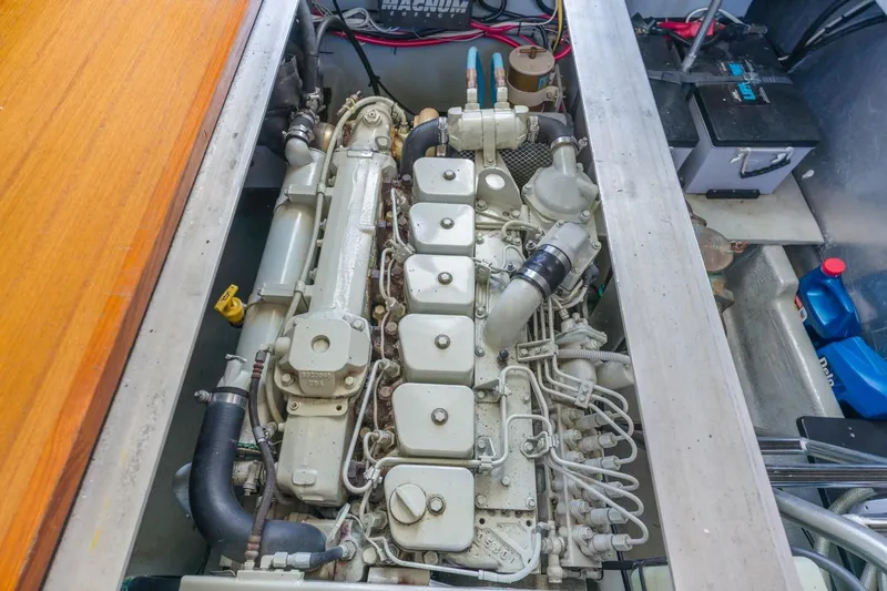 La Woman Yacht Photos Pics Engine compartment of a 2001 Mainship 390 Trawler, showcasing detailed mechanical components.