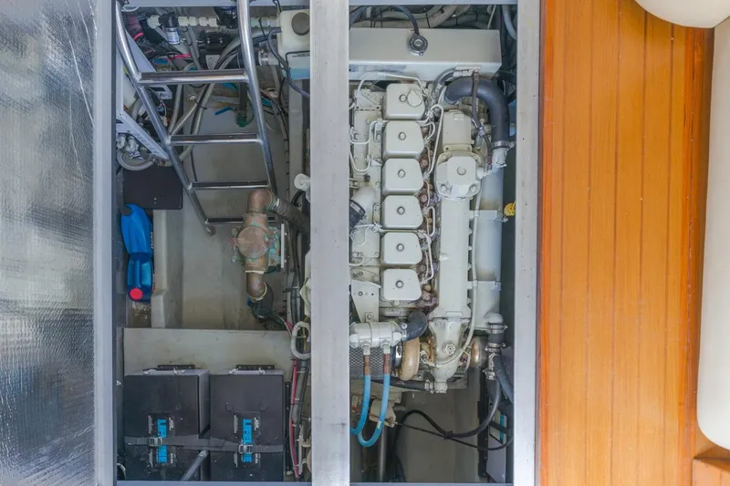 La Woman Yacht Photos Pics Engine room of 2001 Mainship 390 Trawler, showcasing engine and components.