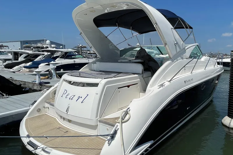 Pearl Yacht Photos Pics 2004 Fairline Targa 40 yacht named "Pearl" docked at a marina.