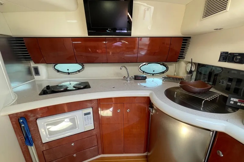 Pearl Yacht Photos Pics 2004 Fairline Targa 40 yacht kitchen with modern appliances and sleek cabinetry.