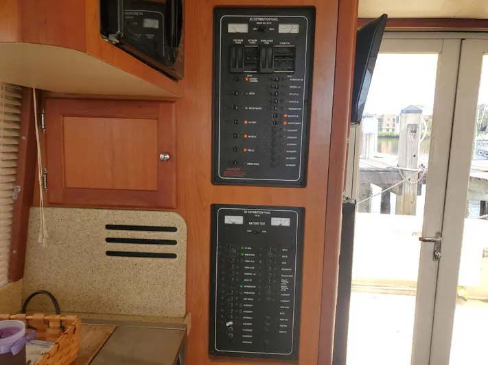 Angels Only Yacht Photos Pics Electrical control panels inside a 2007 Mainship 400 Trawler boat cabin.